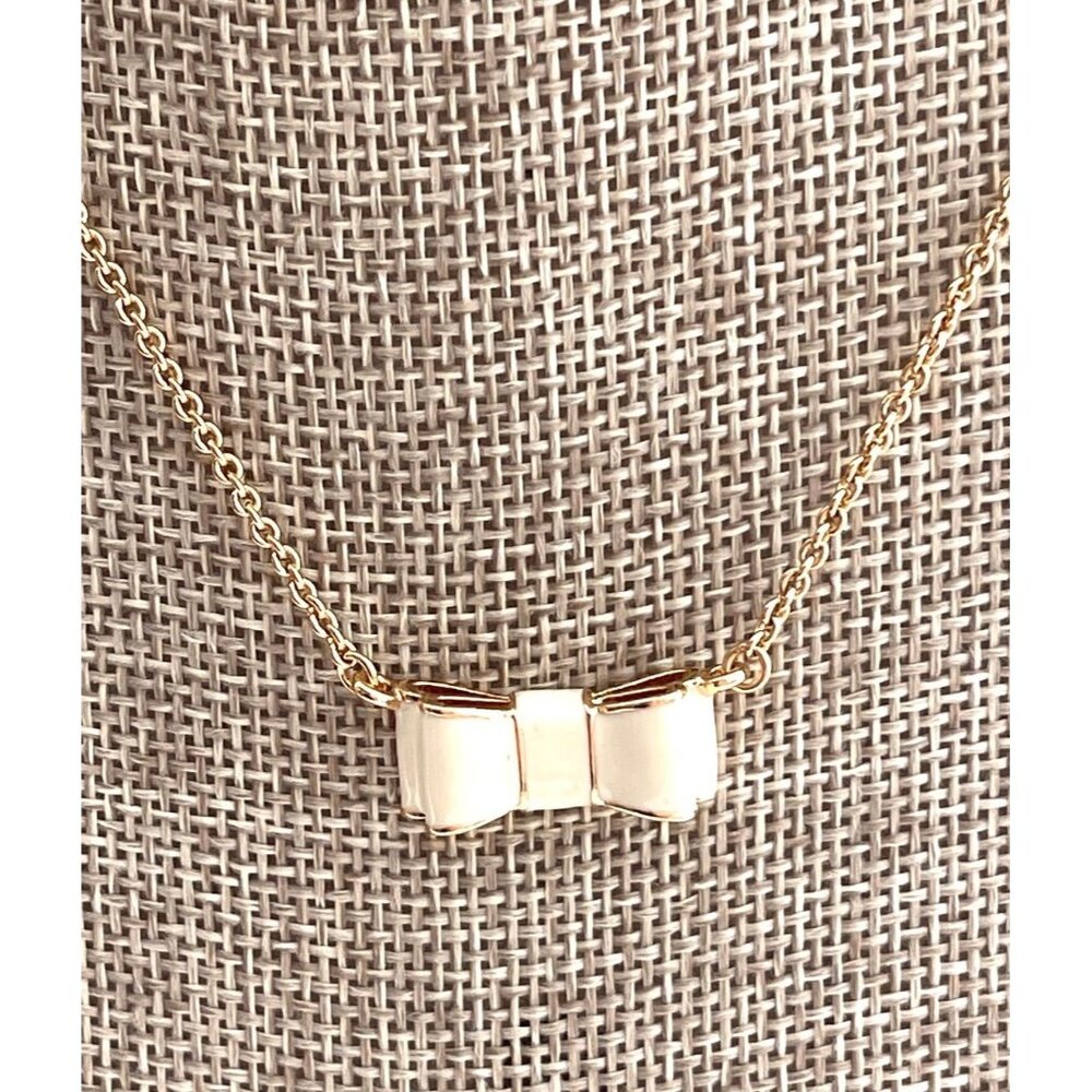 kate spade Gold Tone Bow Pendant Necklace with Cream Enamel